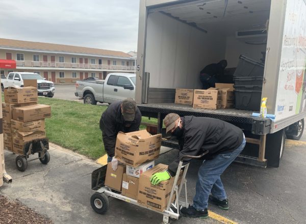 Drivers loading Saving Grace truck