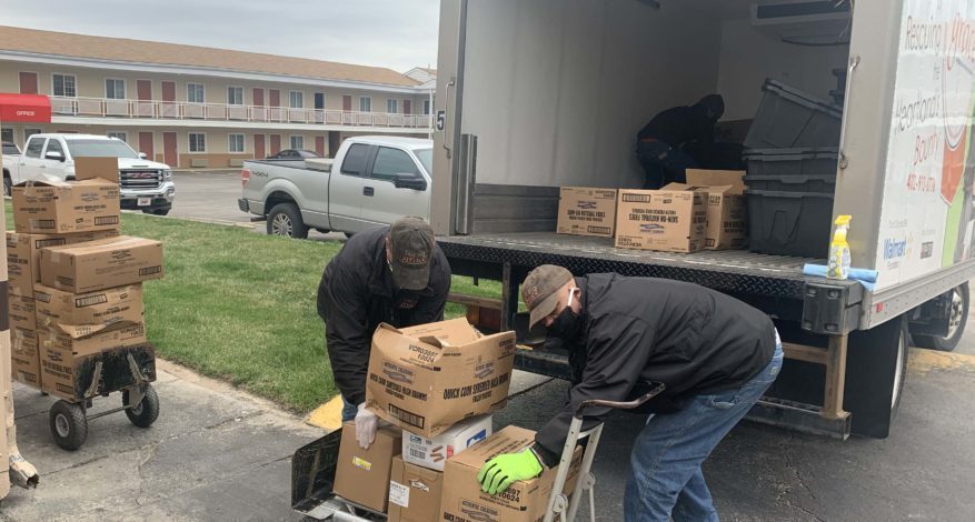 Drivers loading Saving Grace truck